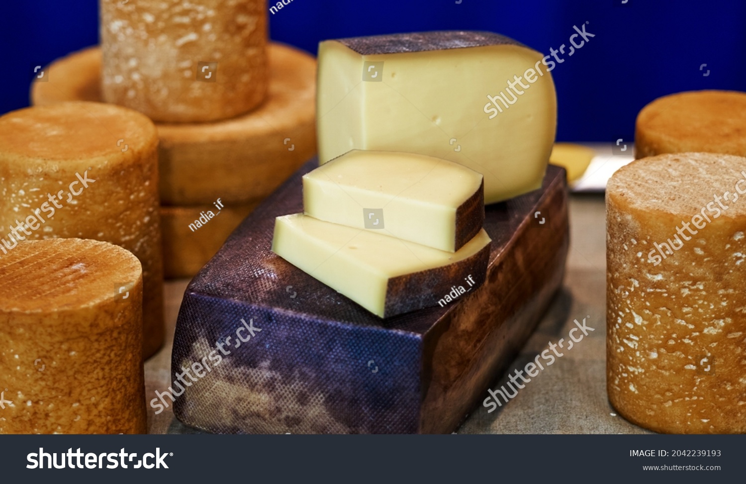 Large selection of cheeses on typical farmer market. Selective focus. High quality photo #2042239193