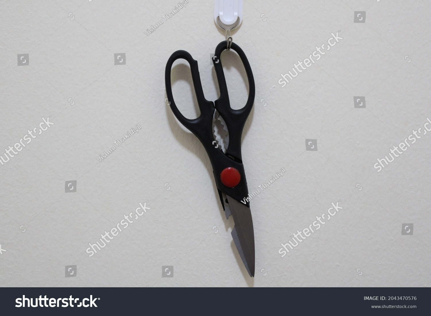 Scissors are hand-operated shearing tools. Scissors are used for cutting various thin materials, such as paper, cardboard, metal foil, cloth, rope, and wire. A large variety of scissors and shears all #2043470576