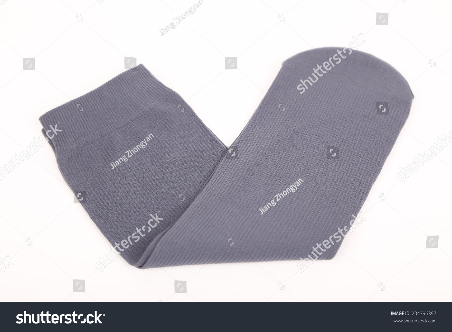 A stack of gray socks isolated on a white  #204396397