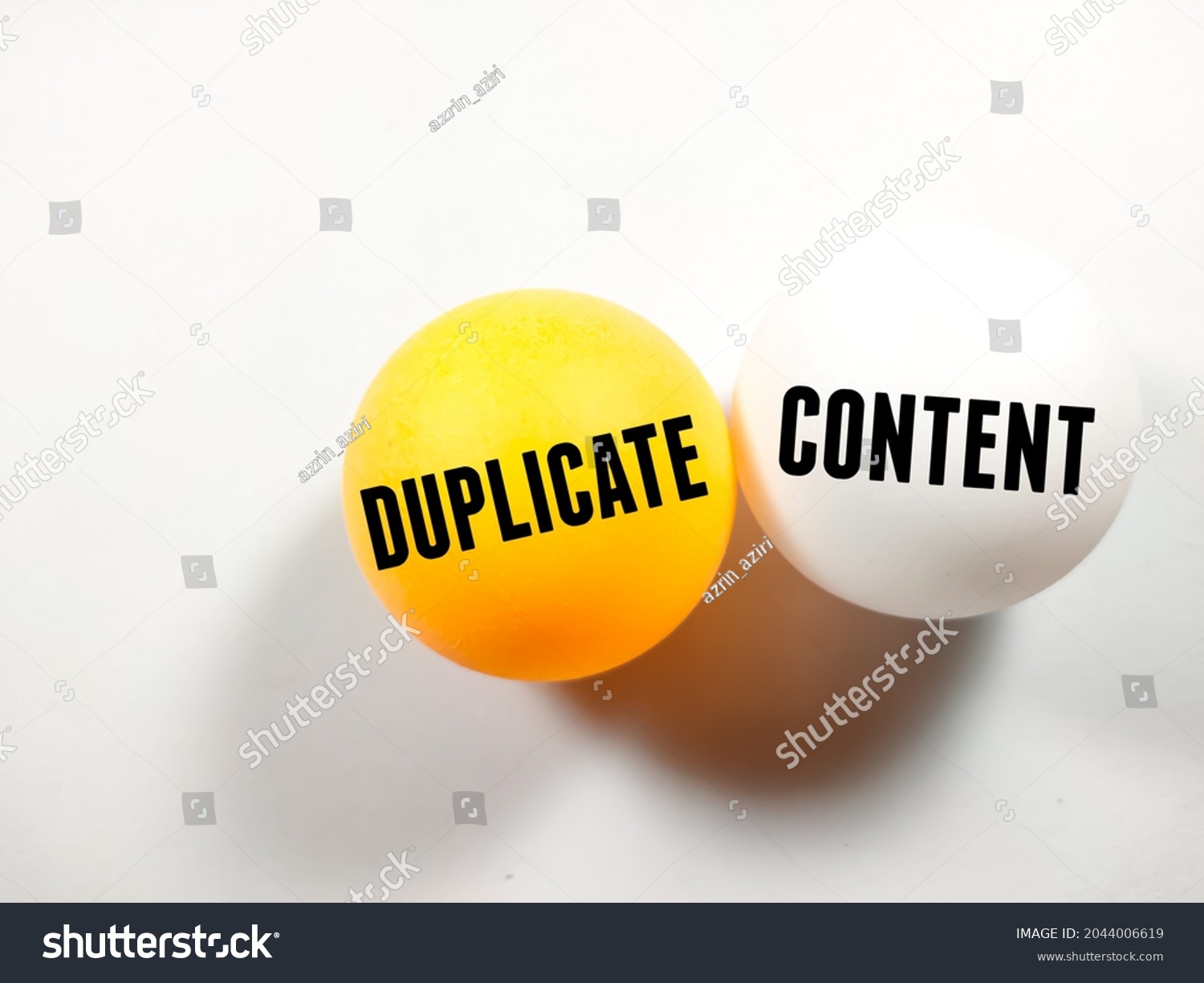 Business concept.Text DUPLICATE CONTENT writing on ping pong ball on white background. #2044006619