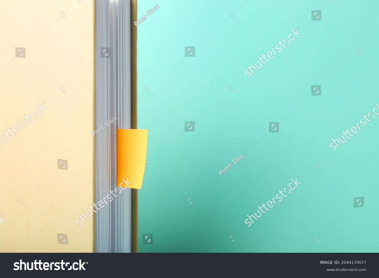 Book with bookmarks on color background, closeup #2044170077