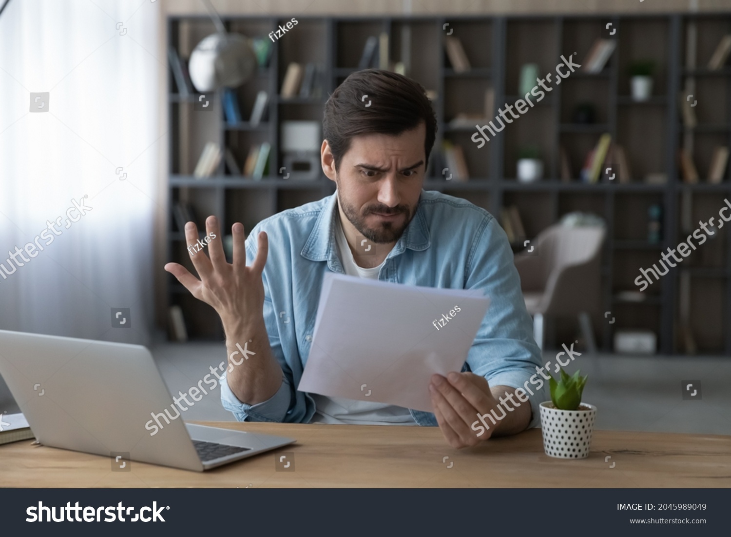 Unhappy man received bad unexpected news in letter, having problem with bank, eviction or dismissal, notice, loss money or debt, shocked businessman reading notification, working with correspondence #2045989049