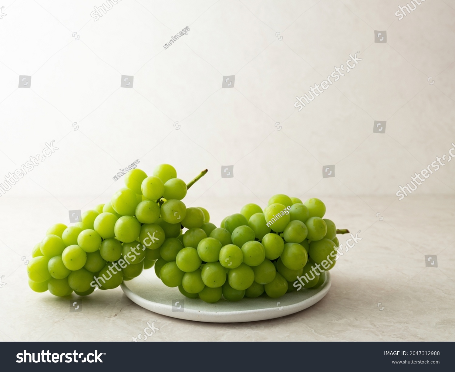 Shine Muscat, green grapes on a plate  #2047312988