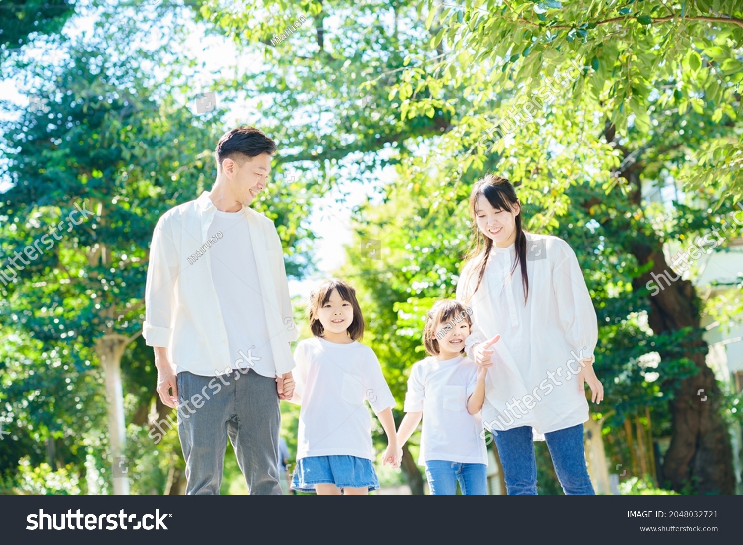 4 family members taking a walk         #2048032721