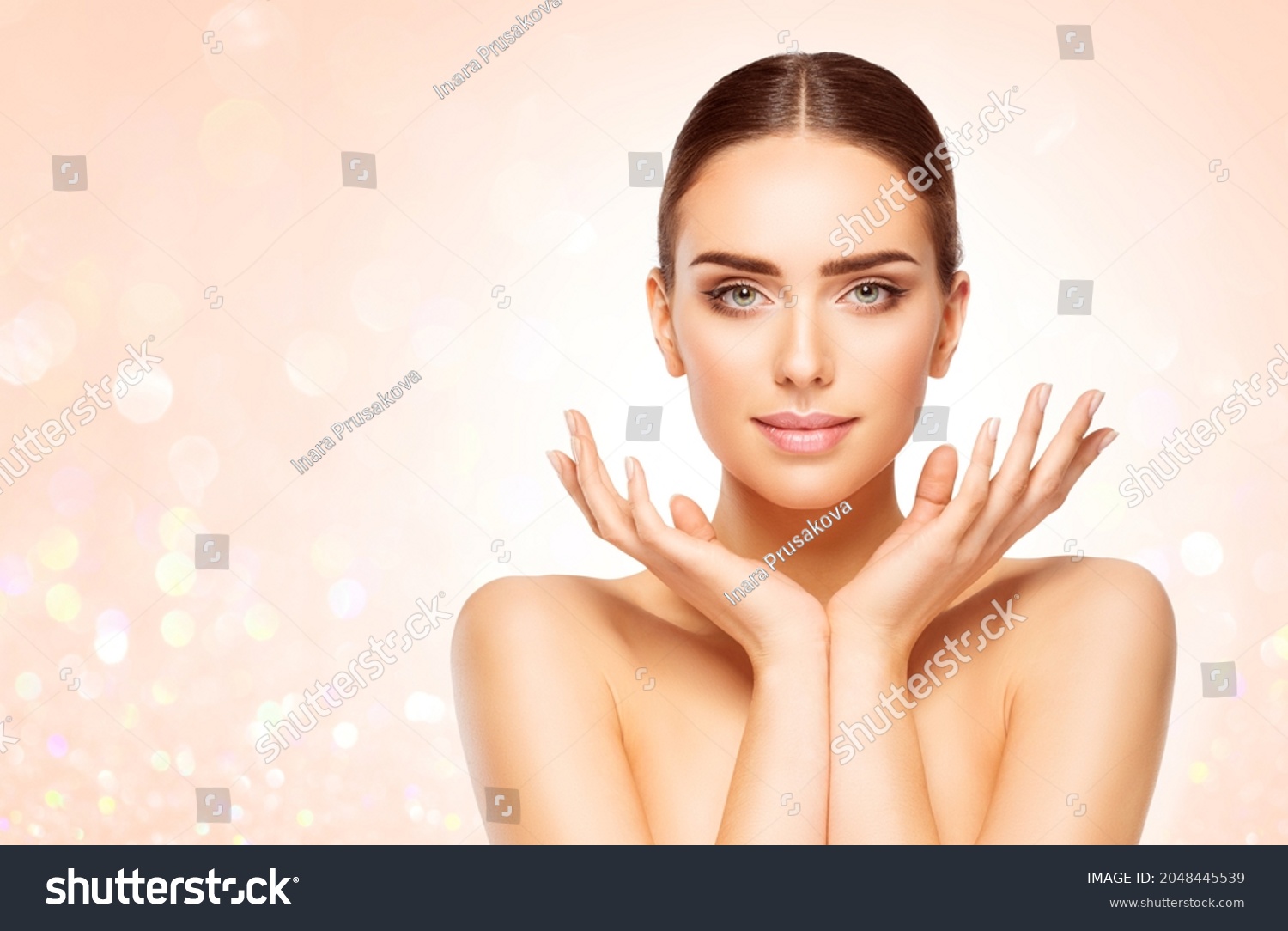 Perfect Skin Face Woman Portrait. Beauty Model with open Hands under Chin over Bright Shining Beige Background. Skin Care Cosmetic Cosmetology #2048445539