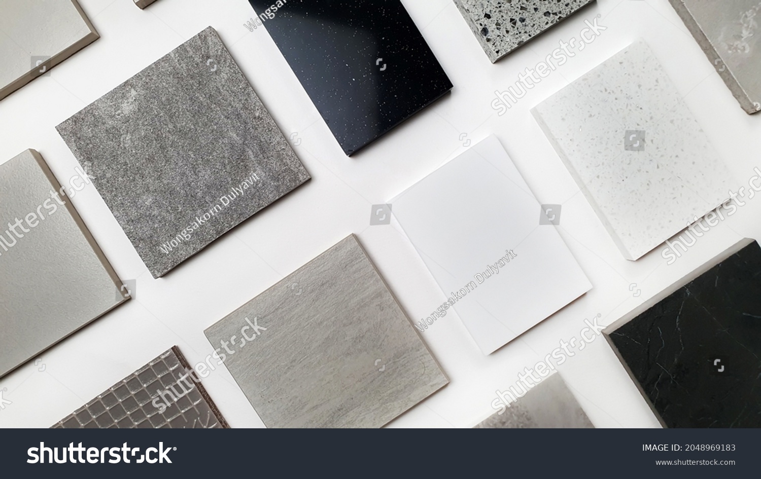 samples of interior stone material consists concrete tiles, quartz stones, artificial stones, graphic tile. top view of interior selected material for mood and tone board. interior materials palette. #2048969183
