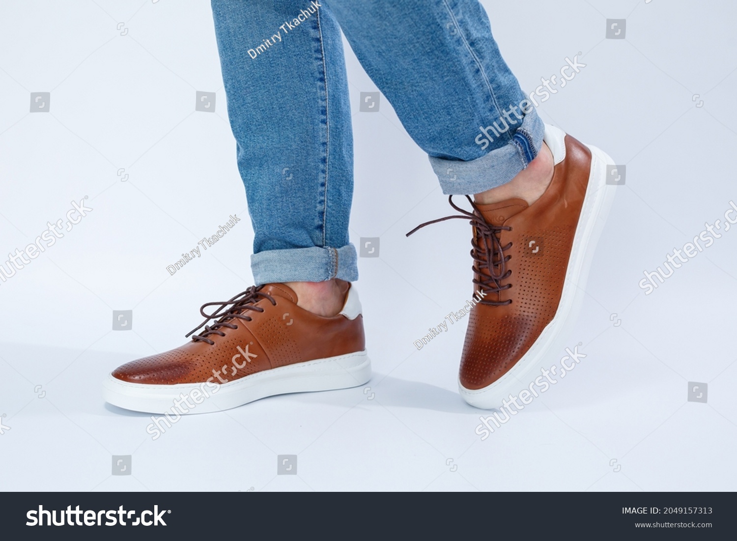 Men's casual shoes are brown with natural leather, men on the shoe in brown lace shoes. High quality photo #2049157313