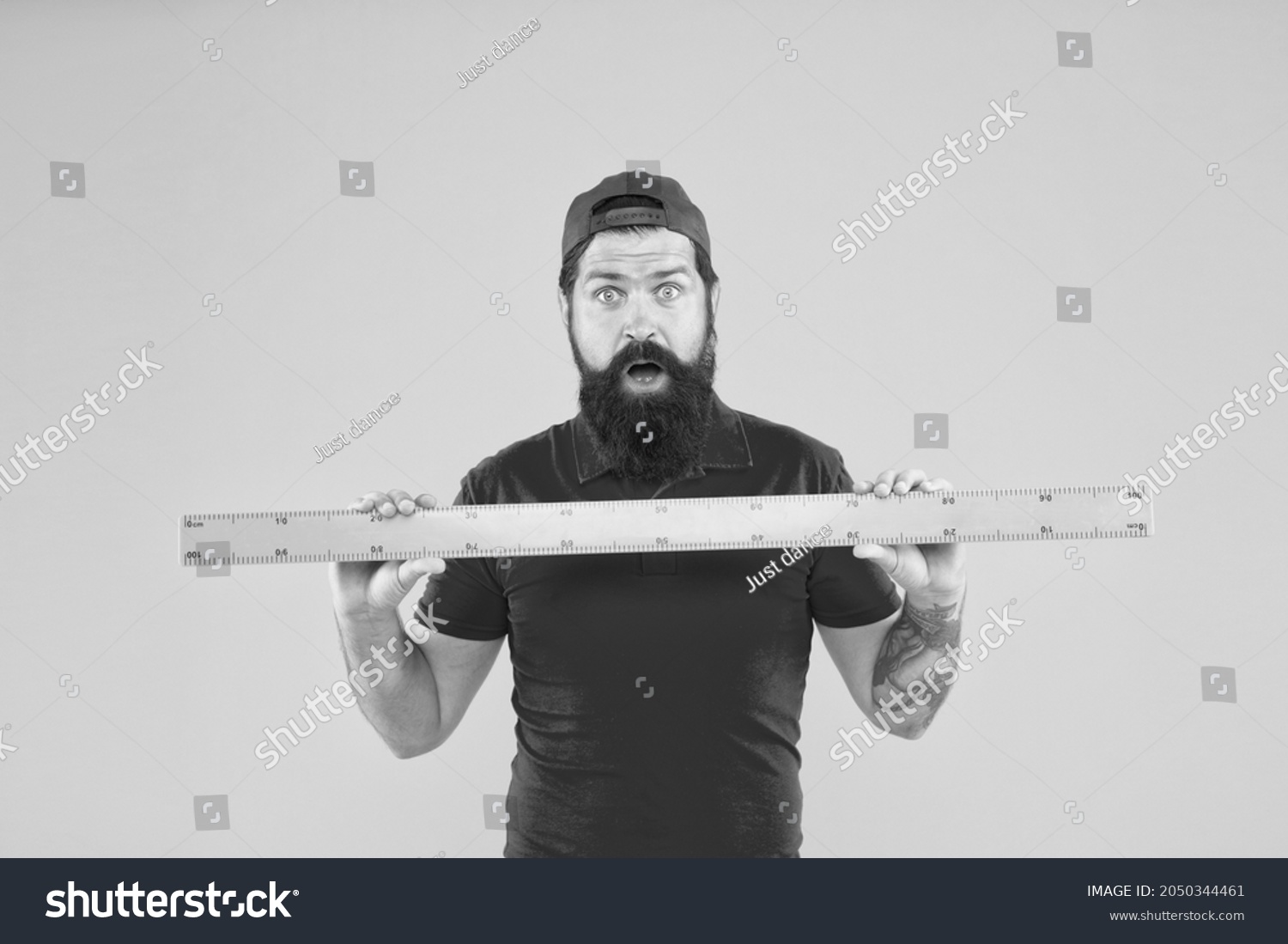 Without geometry life is pointless. Surprised hipster hold ruler yellow background. Geometry lesson. Bearded man use geometrical tool for geometry. Teaching geometry in school #2050344461