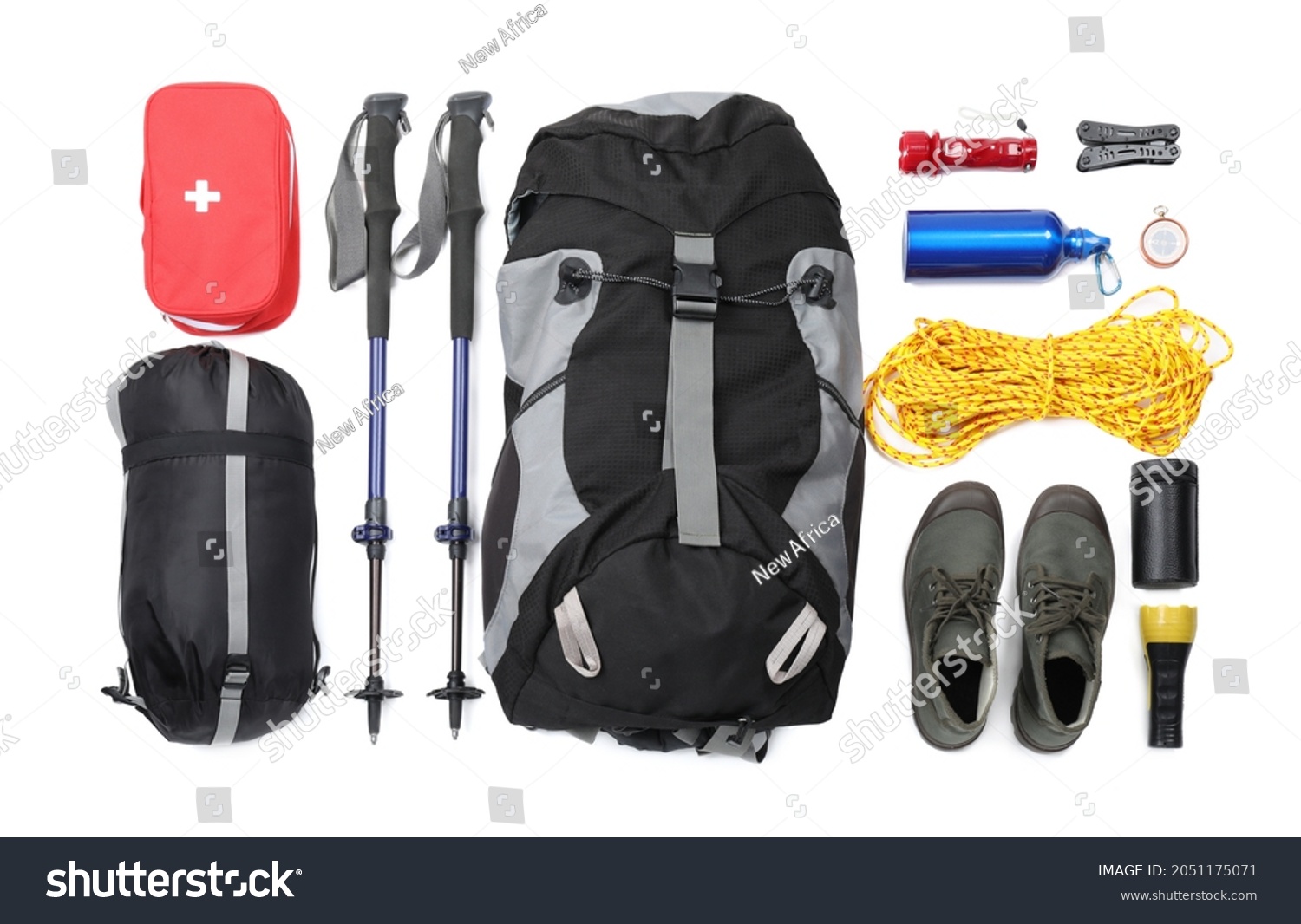 Pair of trekking poles and camping equipment for tourism on white background, top view #2051175071