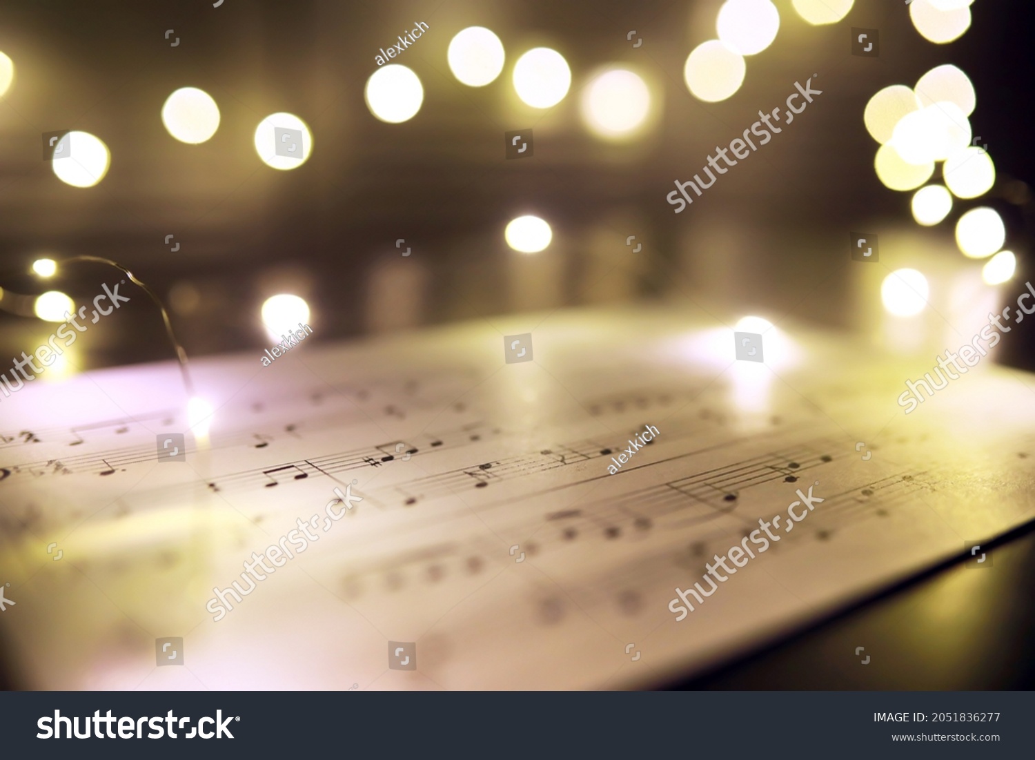 Old sheet with Christmas music notes as background, bokeh effect
 #2051836277