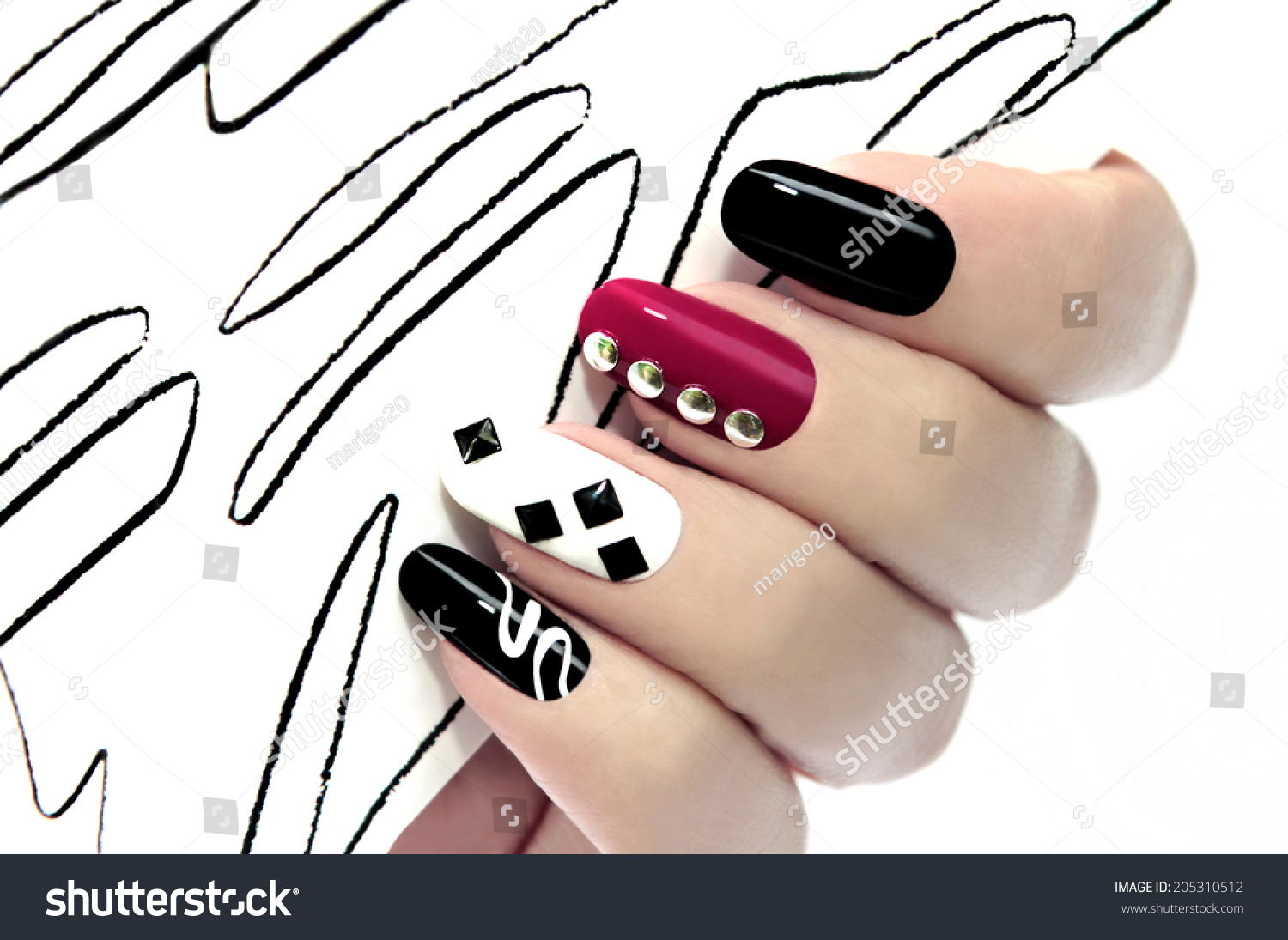 Colorful graphic manicure on an oval shaped nails are covered with black,white,red lacquer. #205310512