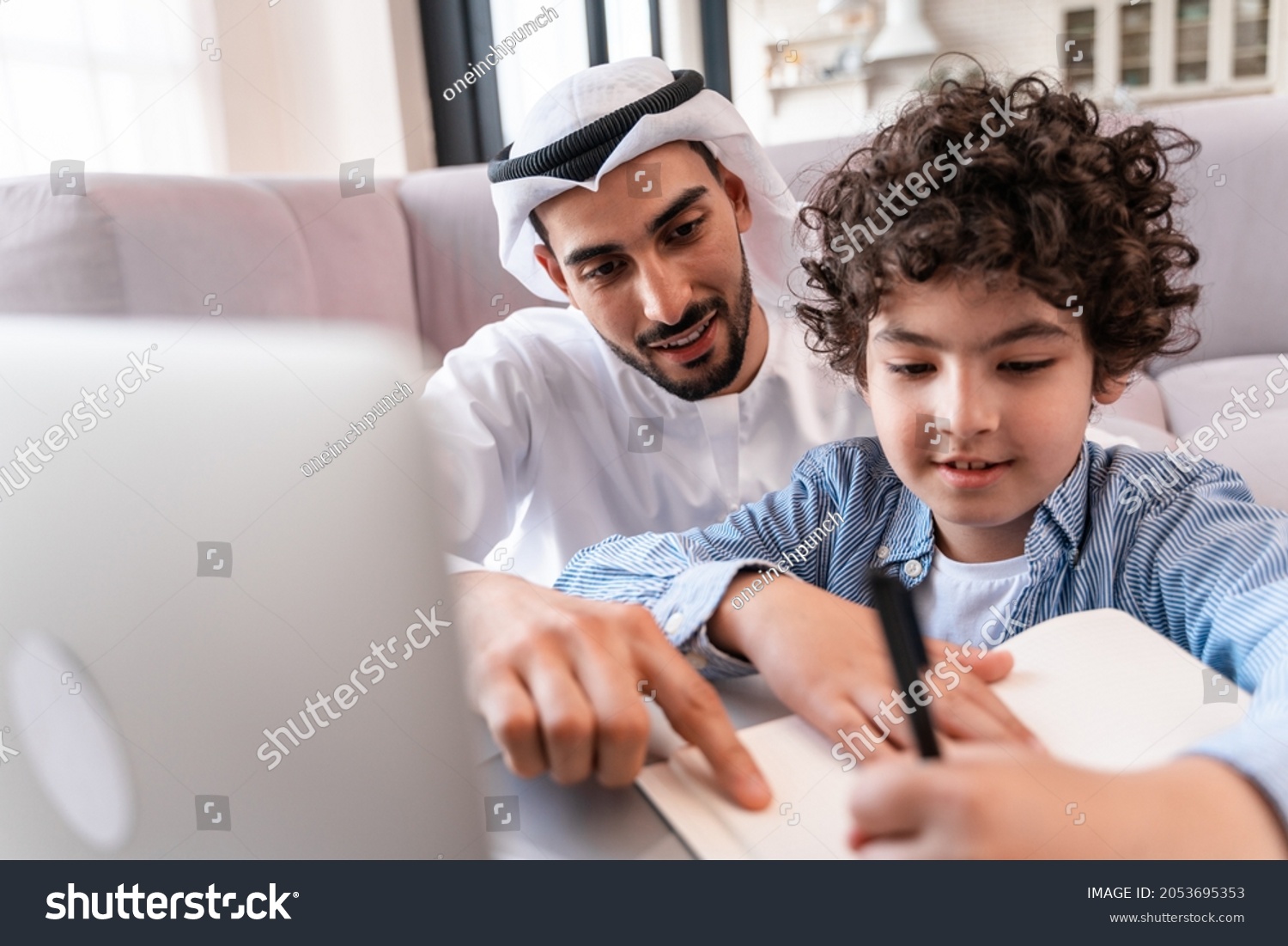 happy family spending time together. Arabian parents and kid lifestyle moments at home #2053695353