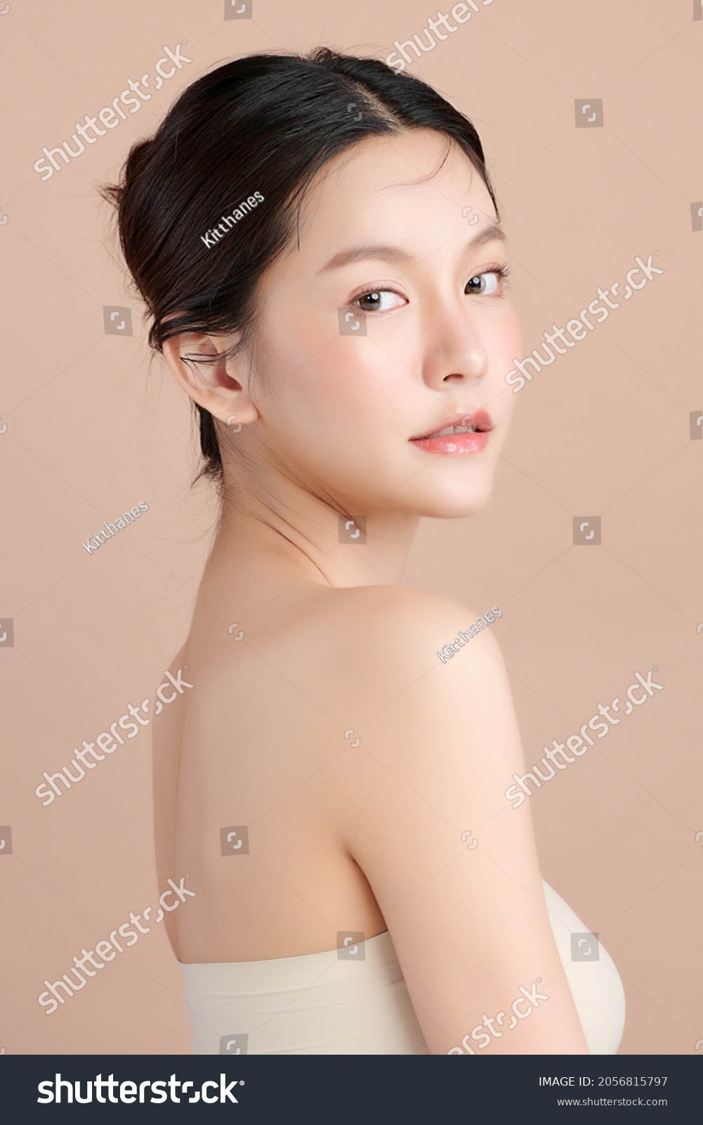 Beautiful young asian woman with clean fresh skin on beige background, Face care, Facial treatment, Cosmetology, beauty and spa, Asian women portrait. #2056815797