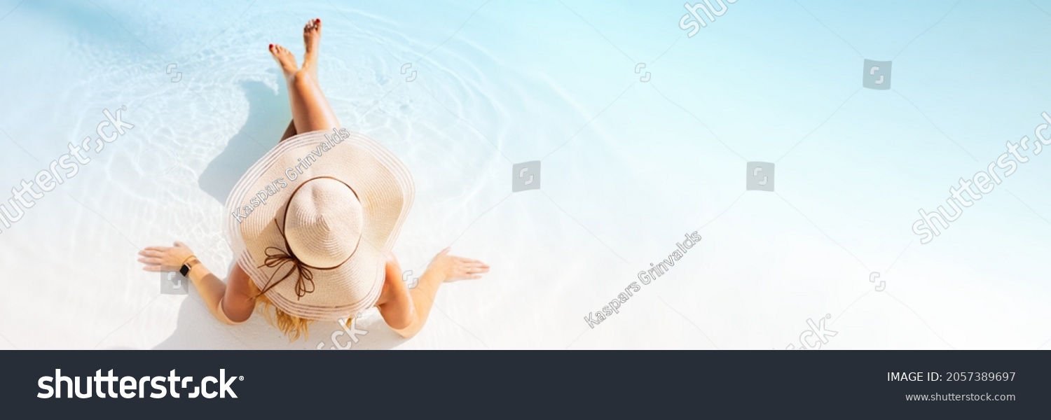 Panorama sized banner of woman relaxing on tropical beach, view from above #2057389697