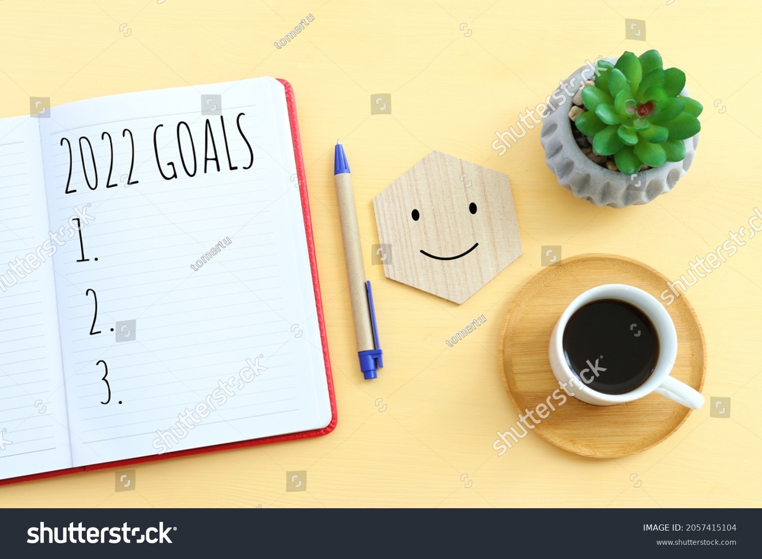 Business concept of top view 2022 goals list with notebook, cup of coffee over wooden desk #2057415104
