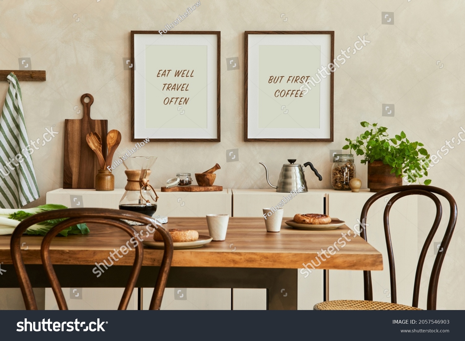 Elegant composition of stylish dining room intrerior with mock up poster frames, beige sideboard, family dining table, plants and vintage personal accessories. Copy space. Template. Autumn vibes. #2057546903