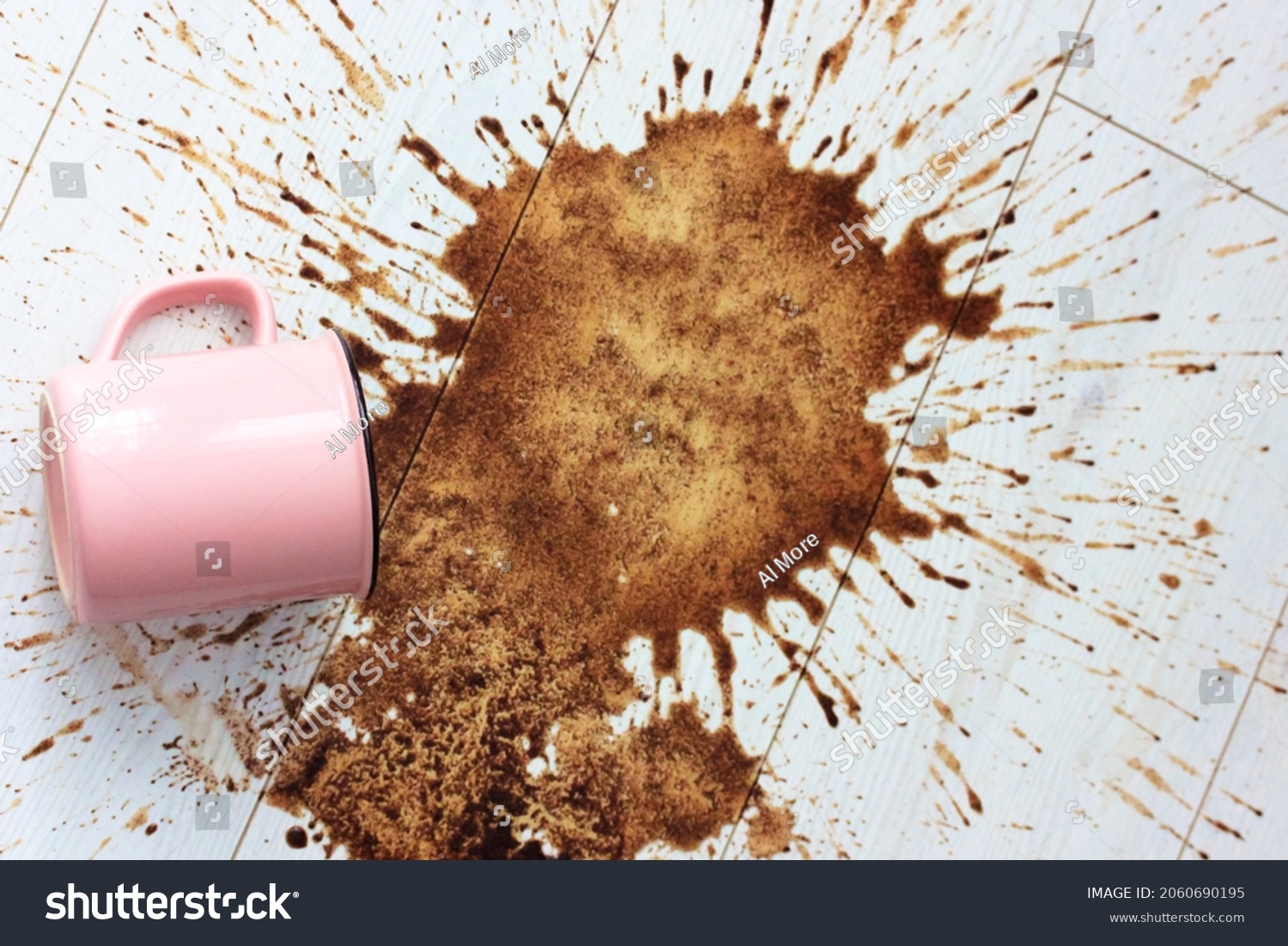A pink ceramic mug, cup fell on a white wooden parquet floor and left a big stain on it. Spilled coffee in the morning. Lots of hot coffee drink brown splashes flying in different directions flatly.  #2060690195