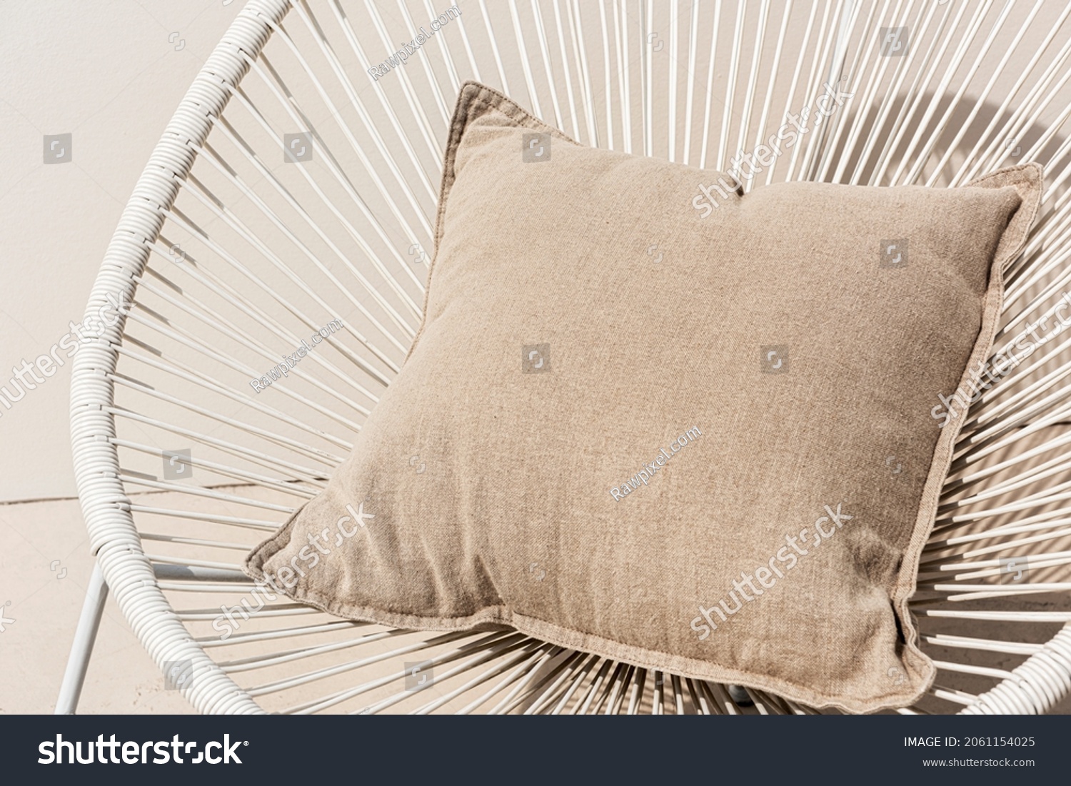Beige printed cushion on a chair minimal interior design #2061154025