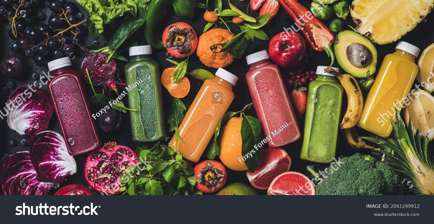 Fresh natural colorful organic juices over ingredients background, wide composition #2061299912