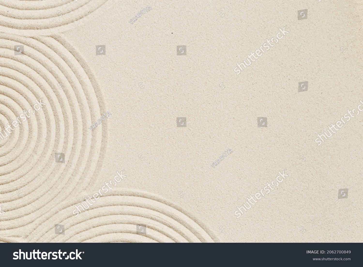 Lines drawing on sand, beautiful sandy texture. Spa background, concept for meditation and relaxation. Concentration and spirituality in Japanese zen garden. View from above. #2062700849