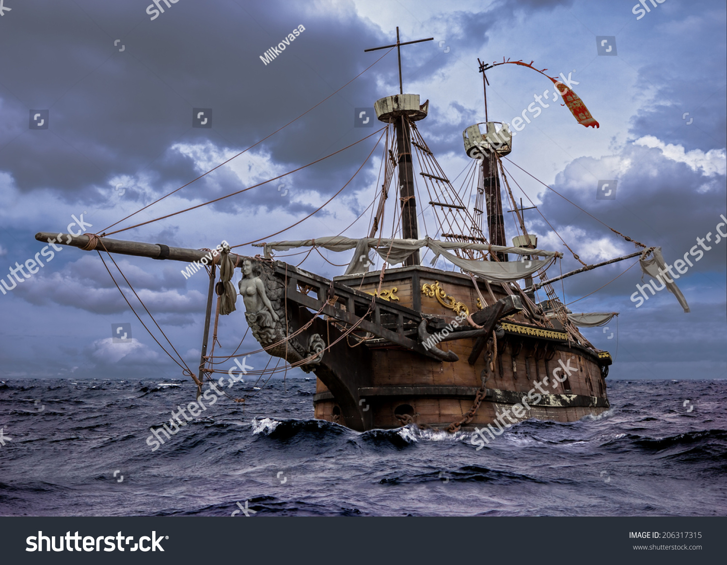 Abandoned historic sailing ship in the stormy sea. Wooden sailboat sails in a storm at sea.  A mysterious boat in stormy ocean waves. #206317315