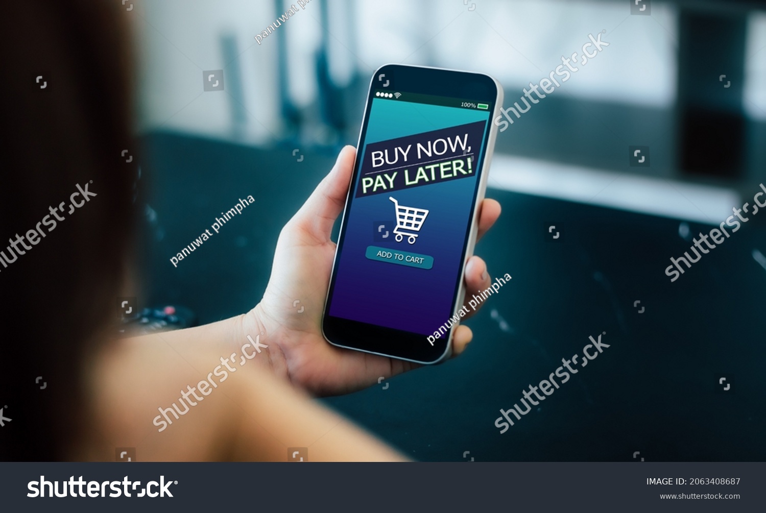 BNPL Buy now pay later online shopping concept.Hands holding mobile phone #2063408687