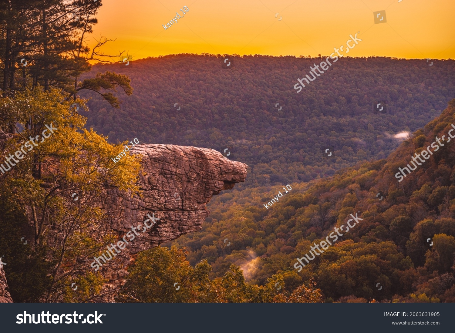 Sunrise at Whitaker Point, known as Hawksbill Crag, during the fall color change of the leaves. Hawksbill is a popular tourist site in the state of Arkansas. #2063631905