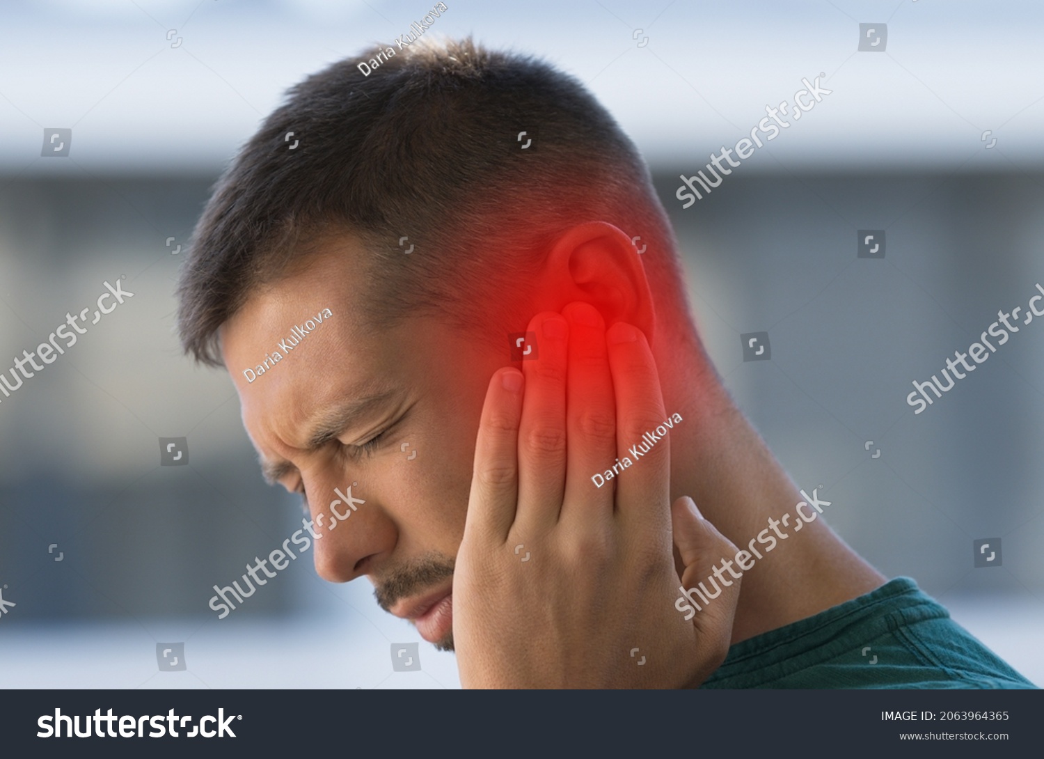 Man suffering from strong earache or ear pain. Ear inflammation, otitis or tinnitus #2063964365