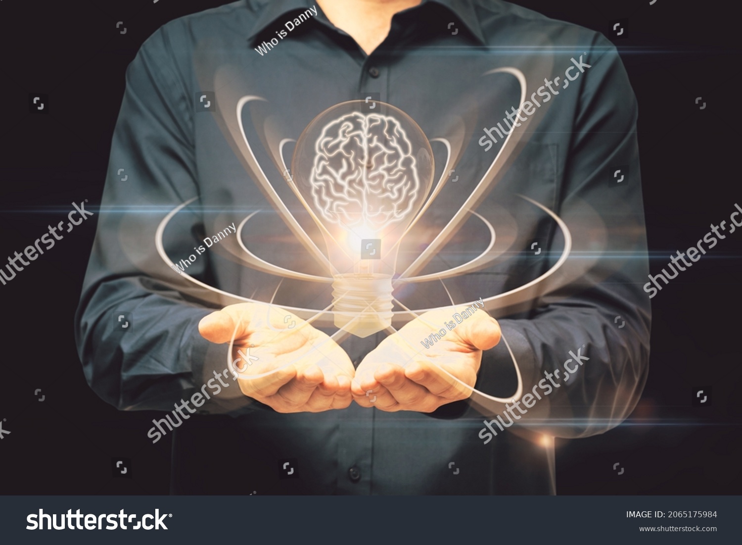 Close up of male hand holding abstract light bulb on dark wide background with digital brain and atom outline. Artificial intelligence, science and innovation concept #2065175984