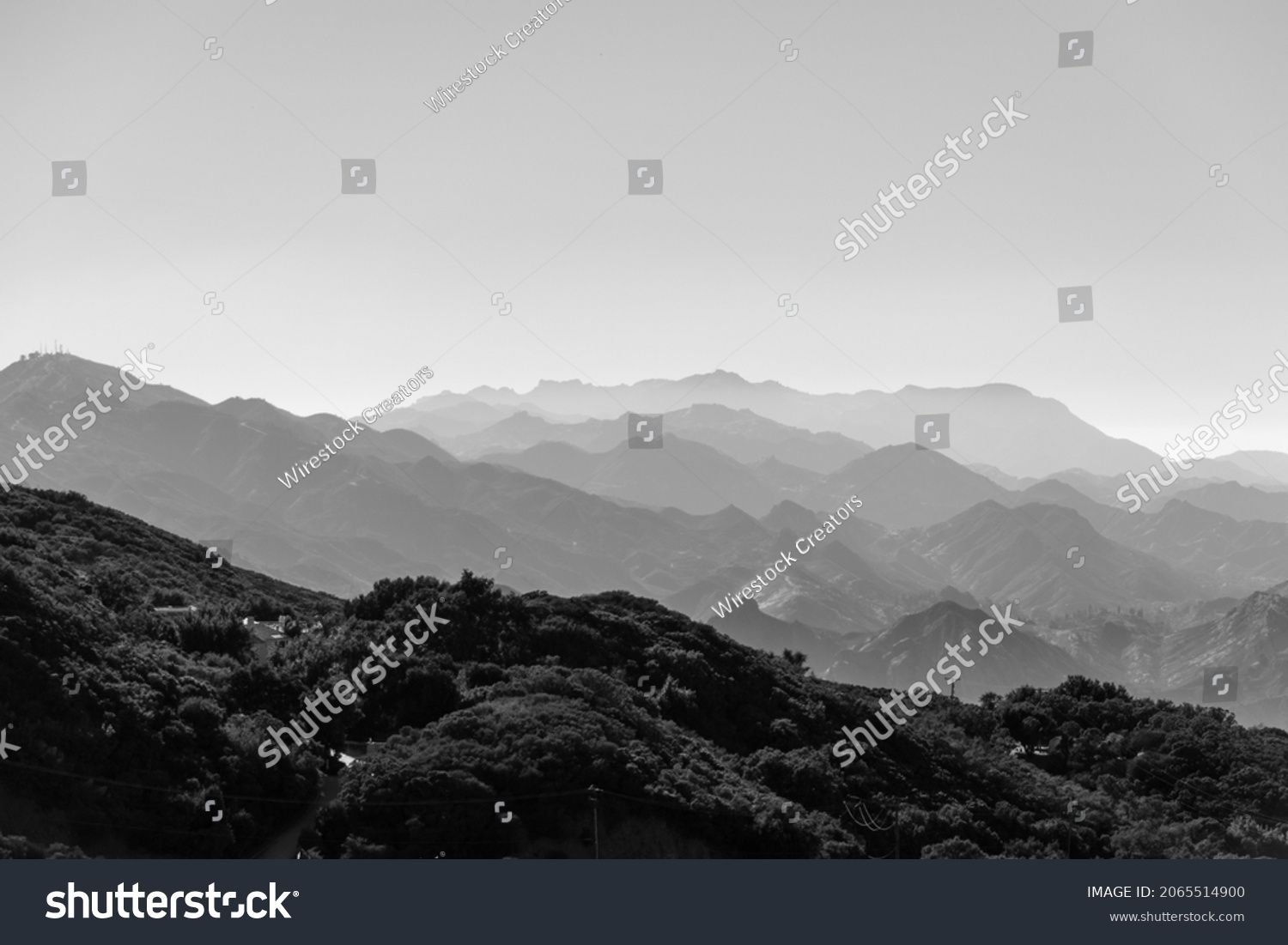 A monochrome shot of foggy mountain range layers, horizontal background #2065514900
