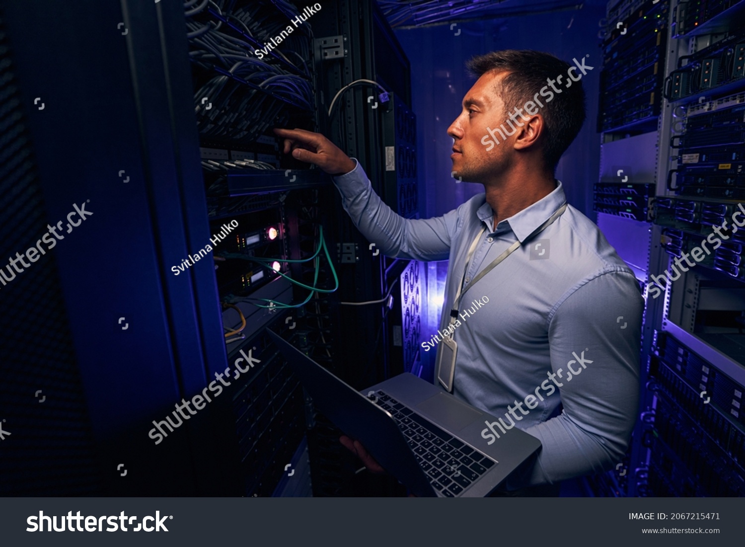 Experienced IT male technician monitoring server performance #2067215471