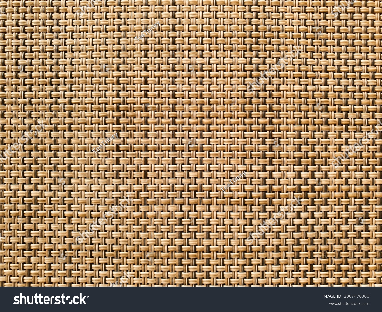 Pattern of wooden twigs constricted together. Wood weaves together forming a mat. Texture of wooden twigs weaved into a structure. Crossing structure of wood.  #2067476360
