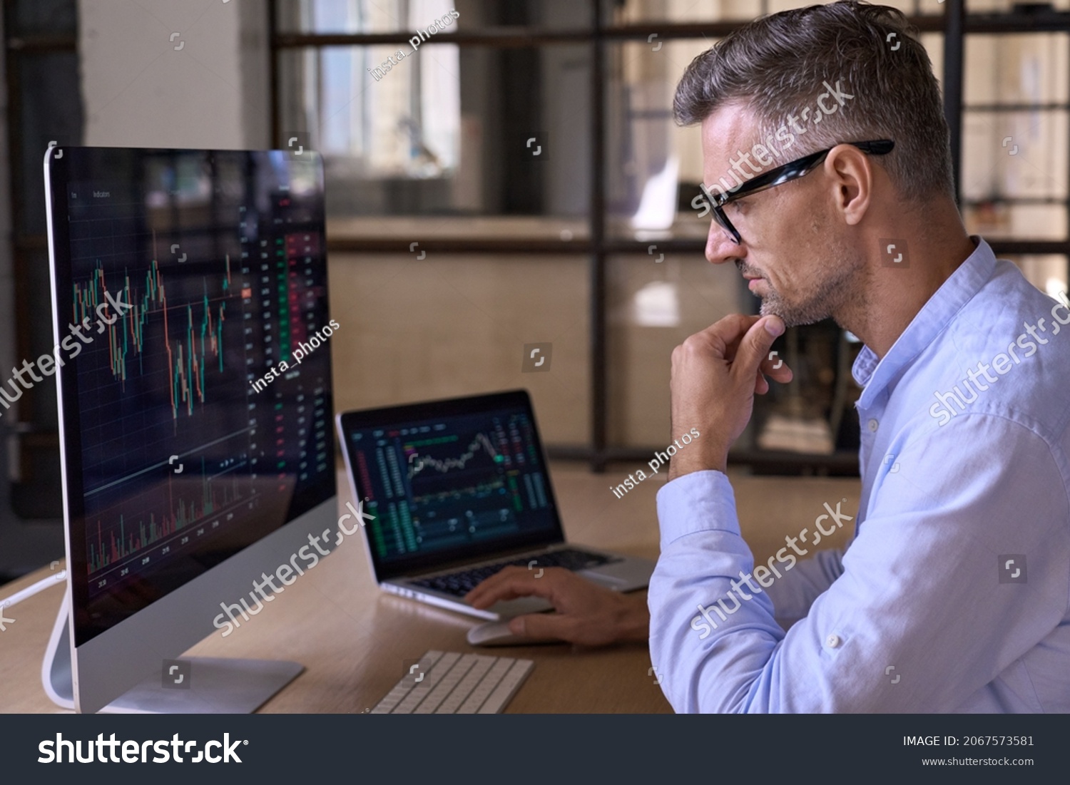 Crypto trader investor analyst broker using pc computer analyzing digital cryptocurrency exchange stock market charts graphs thinking of investing funds risks in trading platform global analytics. #2067573581