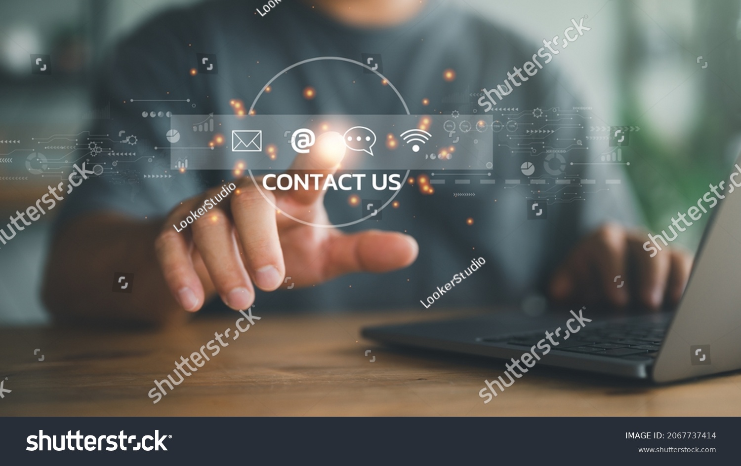 Contact us or Customer support hotline people connect. Businessman using a laptop and touching on virtual screen contact icons ( email, address, live chat, internet wifi ). #2067737414