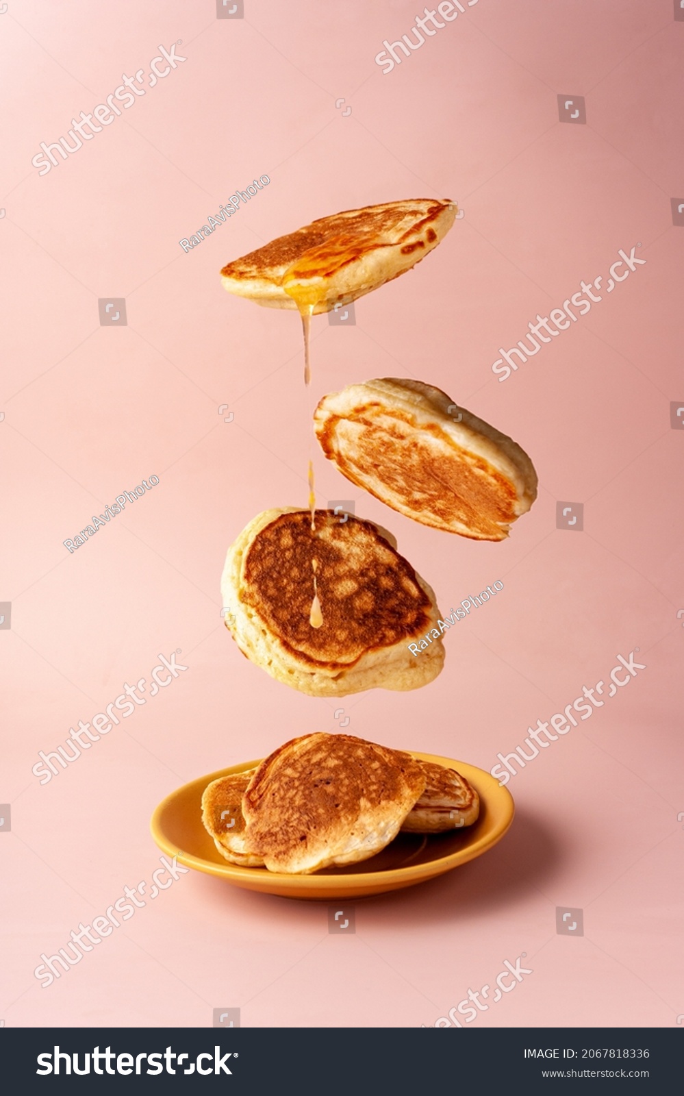 mini pancakes with jam flying food selective focus #2067818336