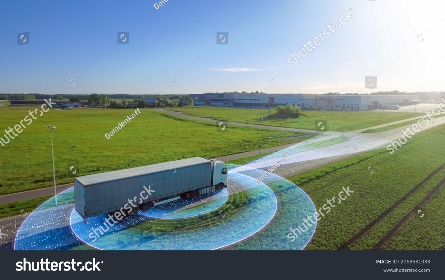 Futuristic High-Tech Concept: Big Semi Truck with Cargo Trailer Drives on the Road is Transformed with Graphics Special Effects Into Digitalized Advanced Autonomous Truck Concept. Aerial Drone Shot #2068631033