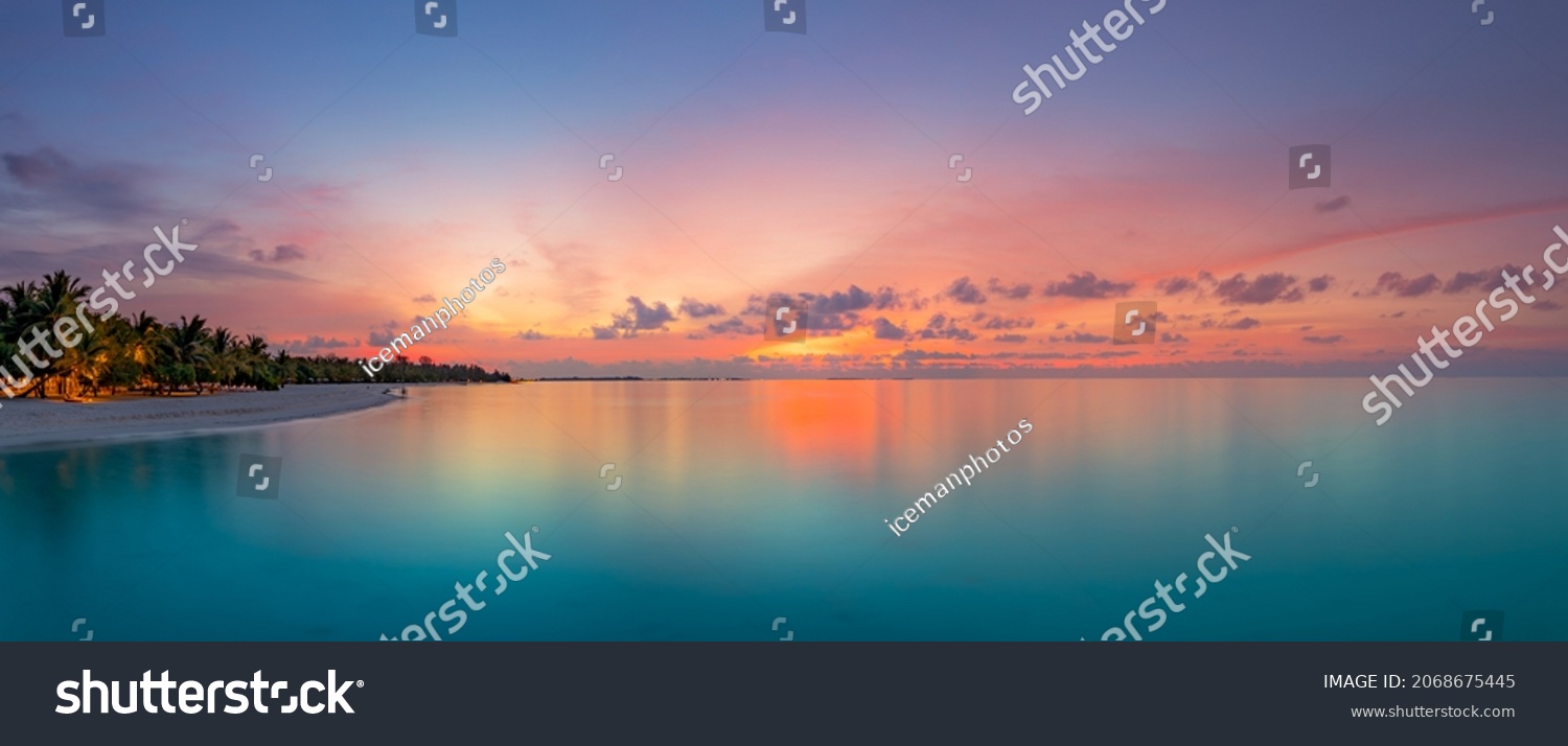 Beautiful panoramic sunset tropical paradise beach. Tranquil summer vacation or holiday landscape. Tropical sunset beach seaside palm calm sea panorama exotic nature view inspirational seascape scenic #2068675445