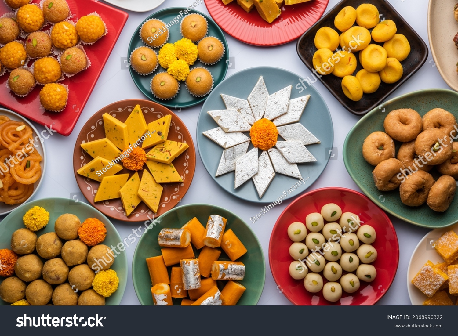 Group of Indian assorted sweets or mithai with diya #2068990322