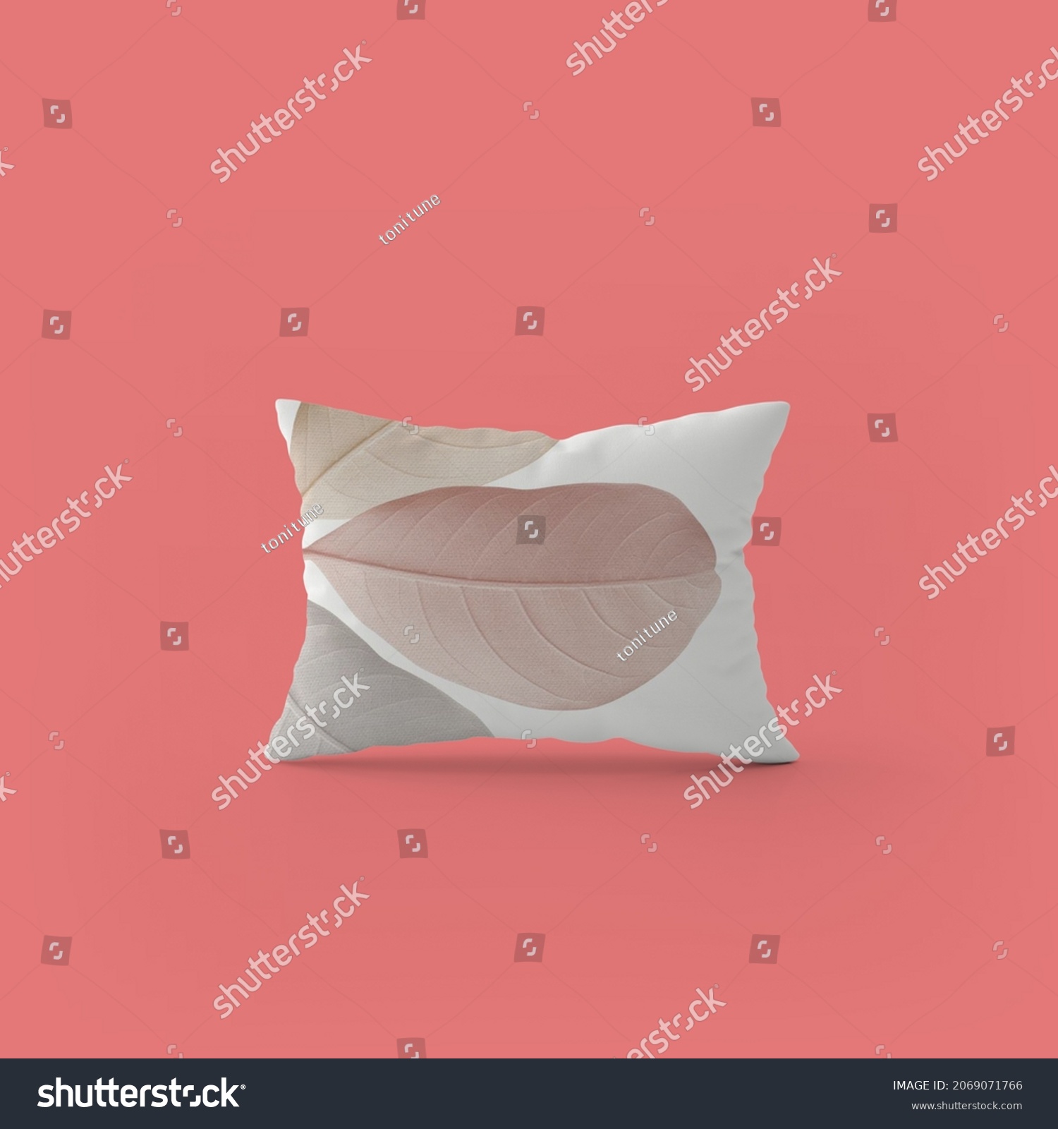 photo of a white pillow with a beautiful three-leaf design and a beautiful pink background #2069071766