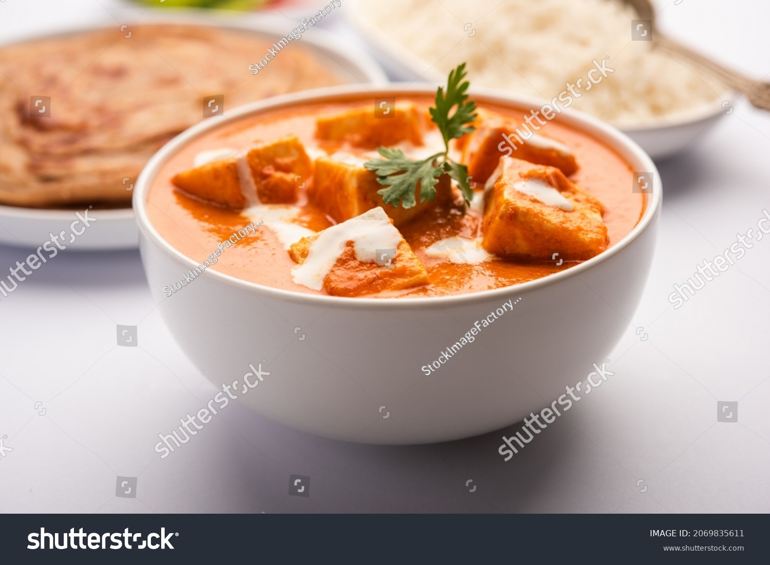 Paneer Butter Masala or Cheese Cottage Curry served with rice and laccha paratha #2069835611