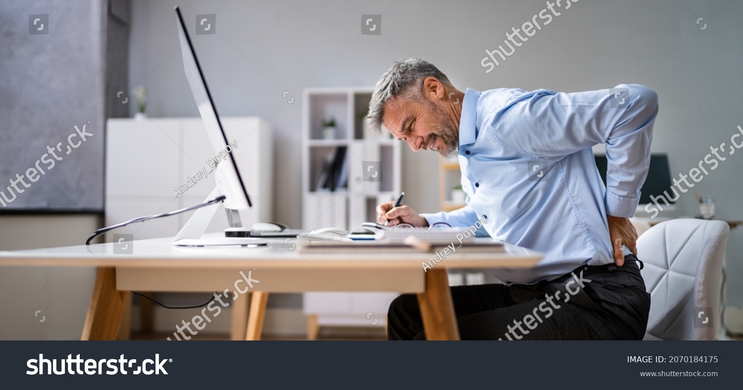 Man With Back Pain. Bad Office Posture #2070184175
