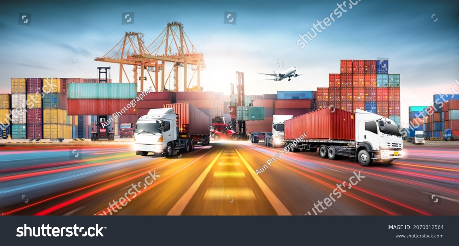 Global business logistics import export and container cargo freight ship during loading at industrial port by crane, container handlers, cargo plane, truck on highway, transportation industry concept #2070812564