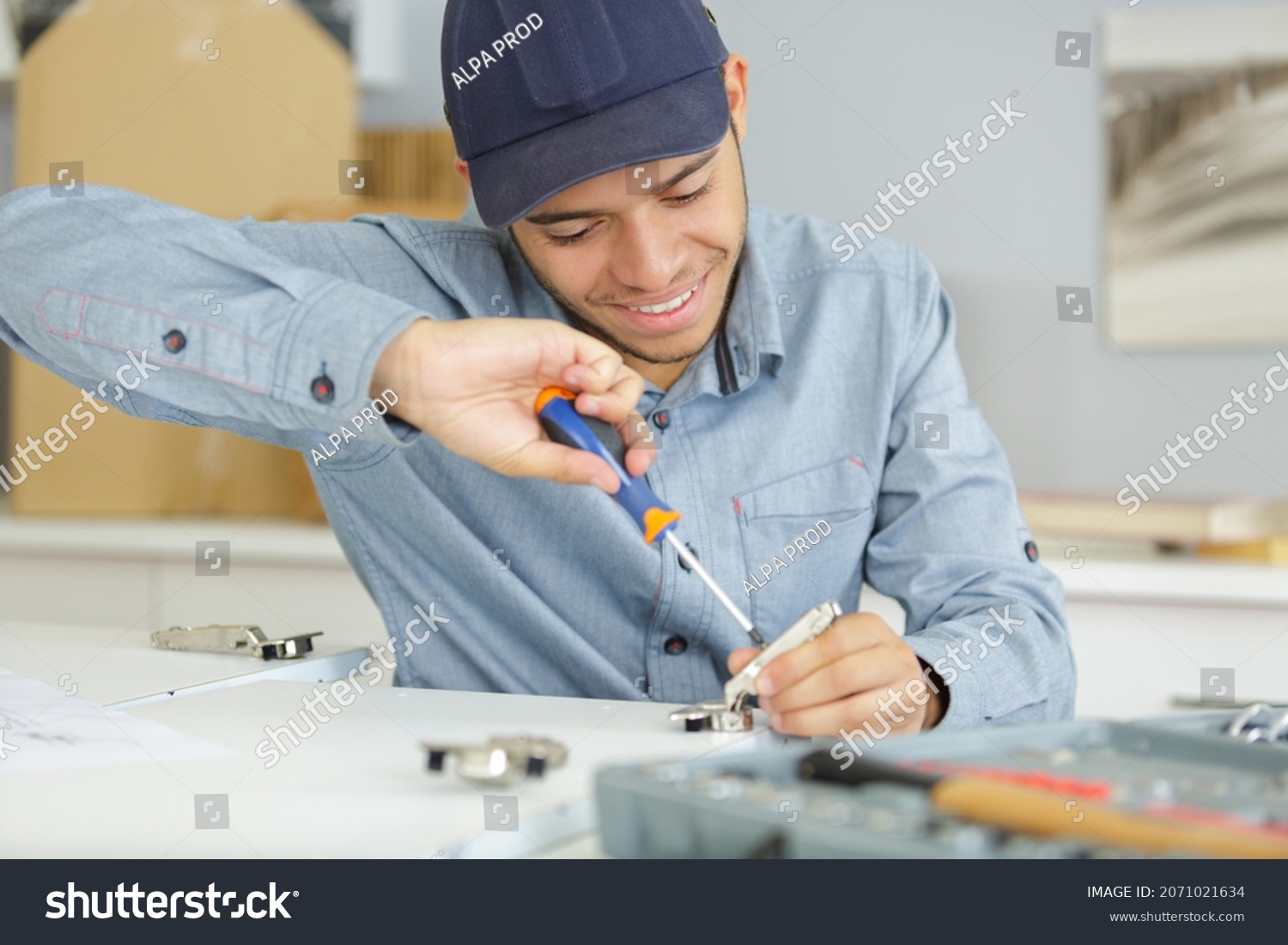 man holding a screw driver tool #2071021634