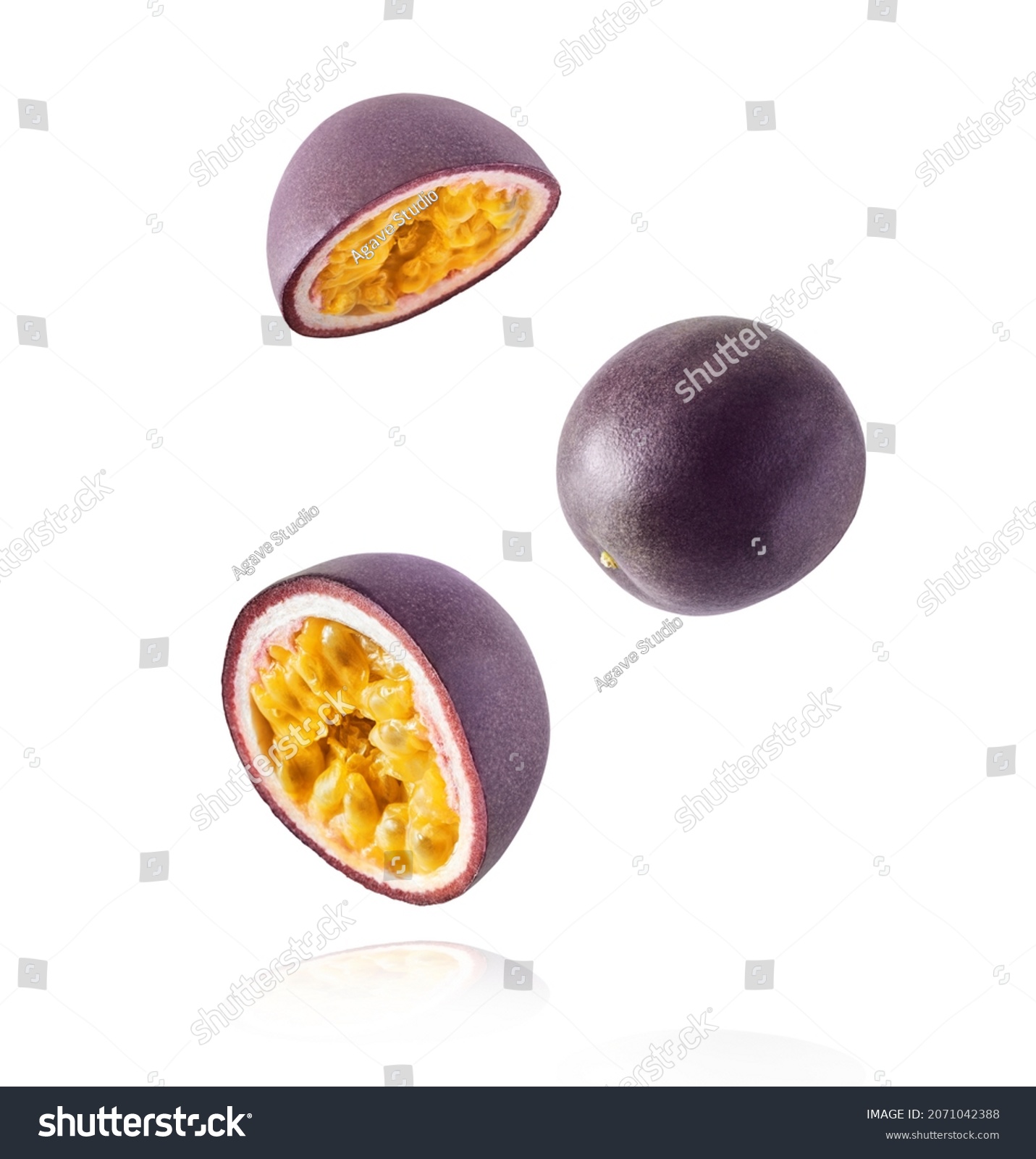 Fresh ripe raw passion fruit falling in the air isolated on white background. Zero gravity and food levitation concept. High resolution #2071042388