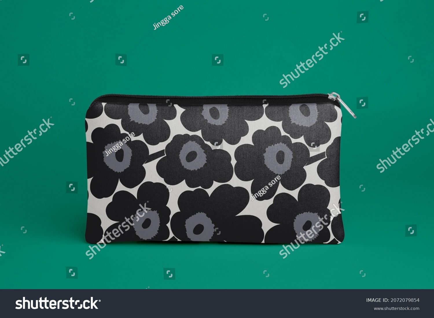 a beautiful pouch with a very cool flower that has a dark blue and black color #2072079854