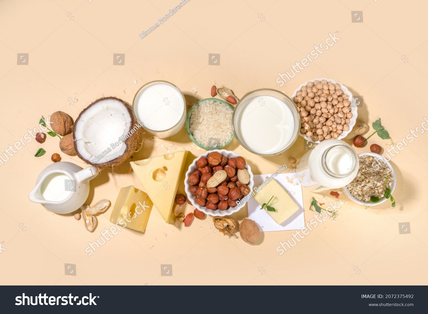 Vegan non-dairy products. Plant-based alternative dairy products – milk, cream, butter, yogurt, cheese, with ingredients - chickpeas, oatmeal, rice, coconut, nuts #2072375492