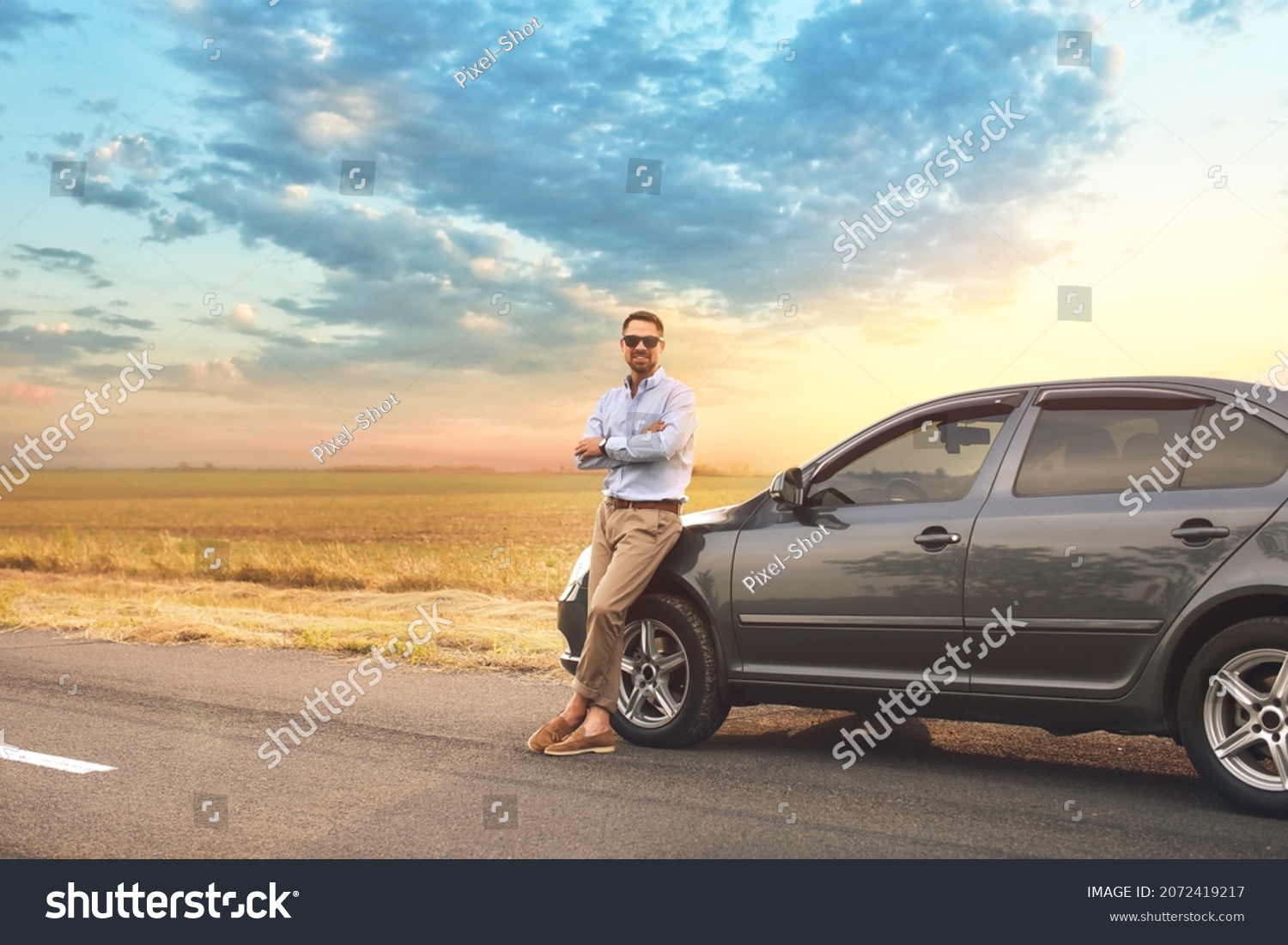 Handsome man near modern car #2072419217