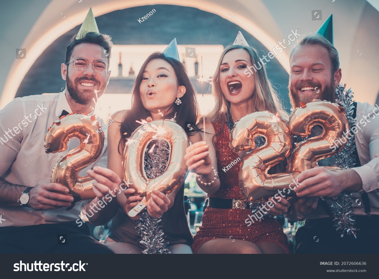 Men and women celebrating the new year 2022 #2072606636