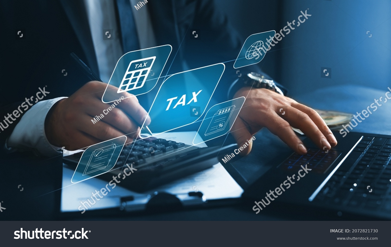 Financial research,government taxes and calculation tax return concept. Businessman using the laptop to fill in the income  tax online return form for payment.  #2072821730