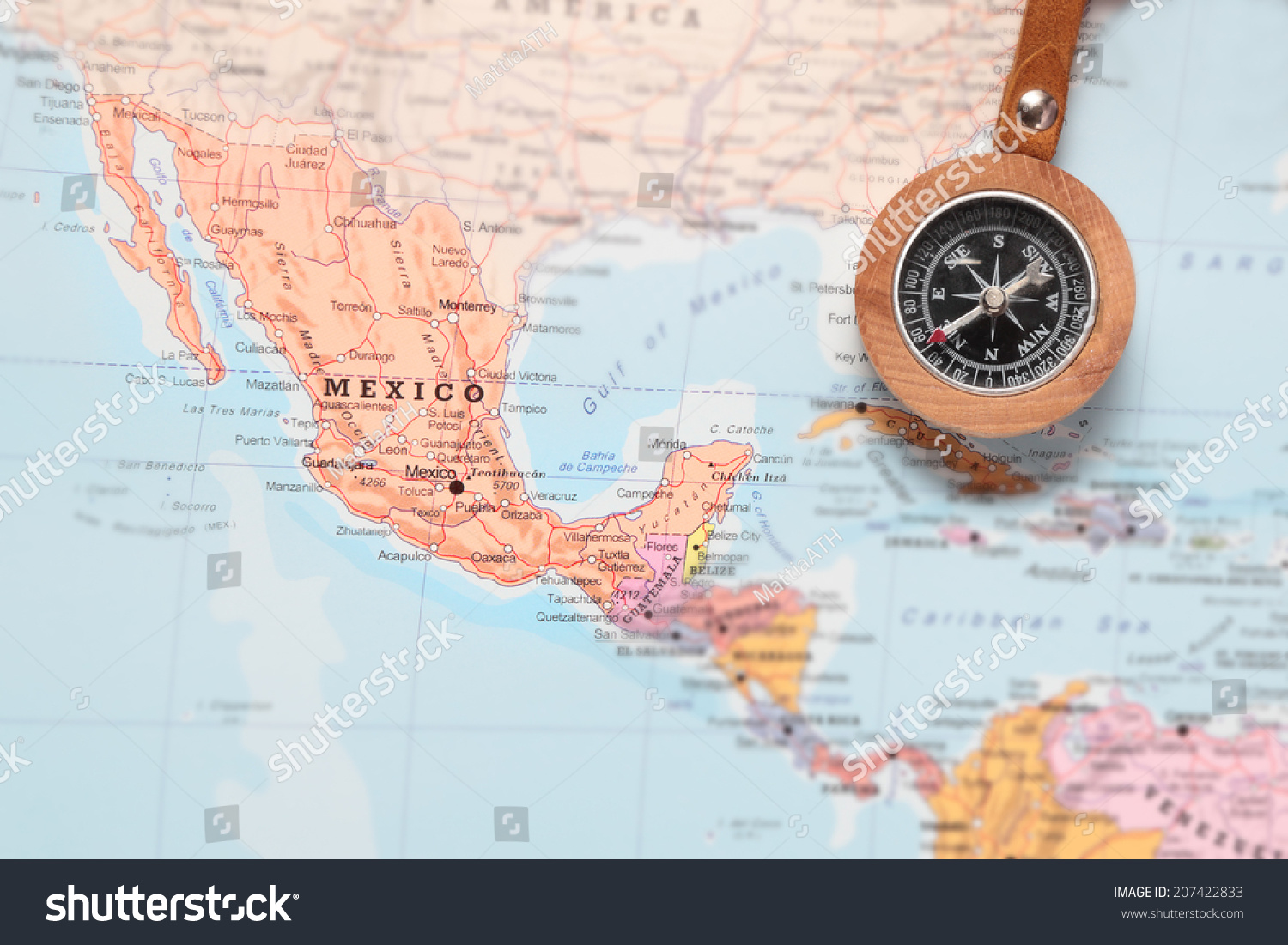 Compass on a map pointing at Mexico and planning a travel destination #207422833